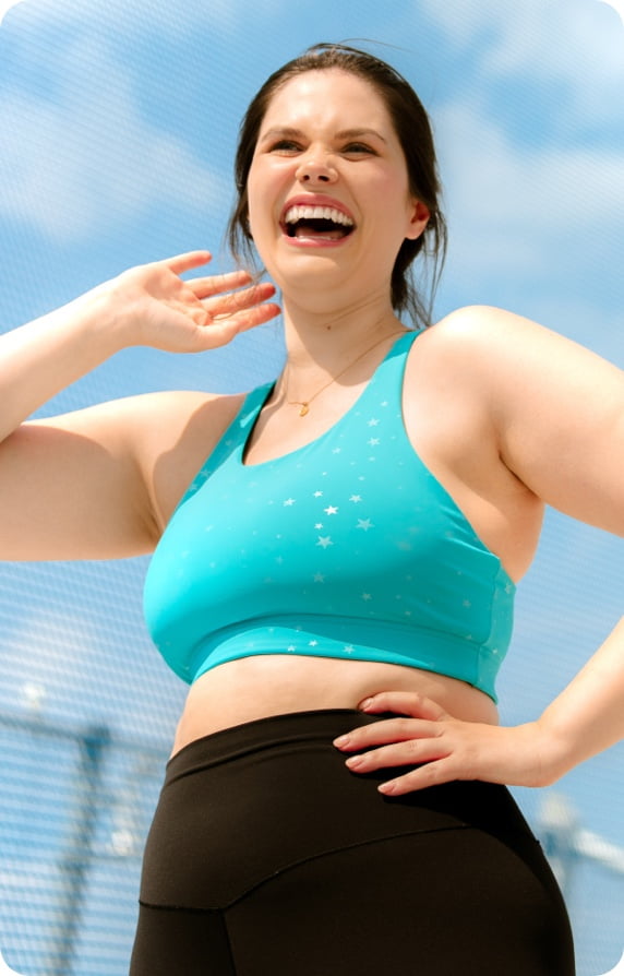 woman laughing in workout gear