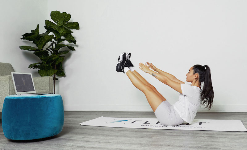 Woman doing pilates core exercise